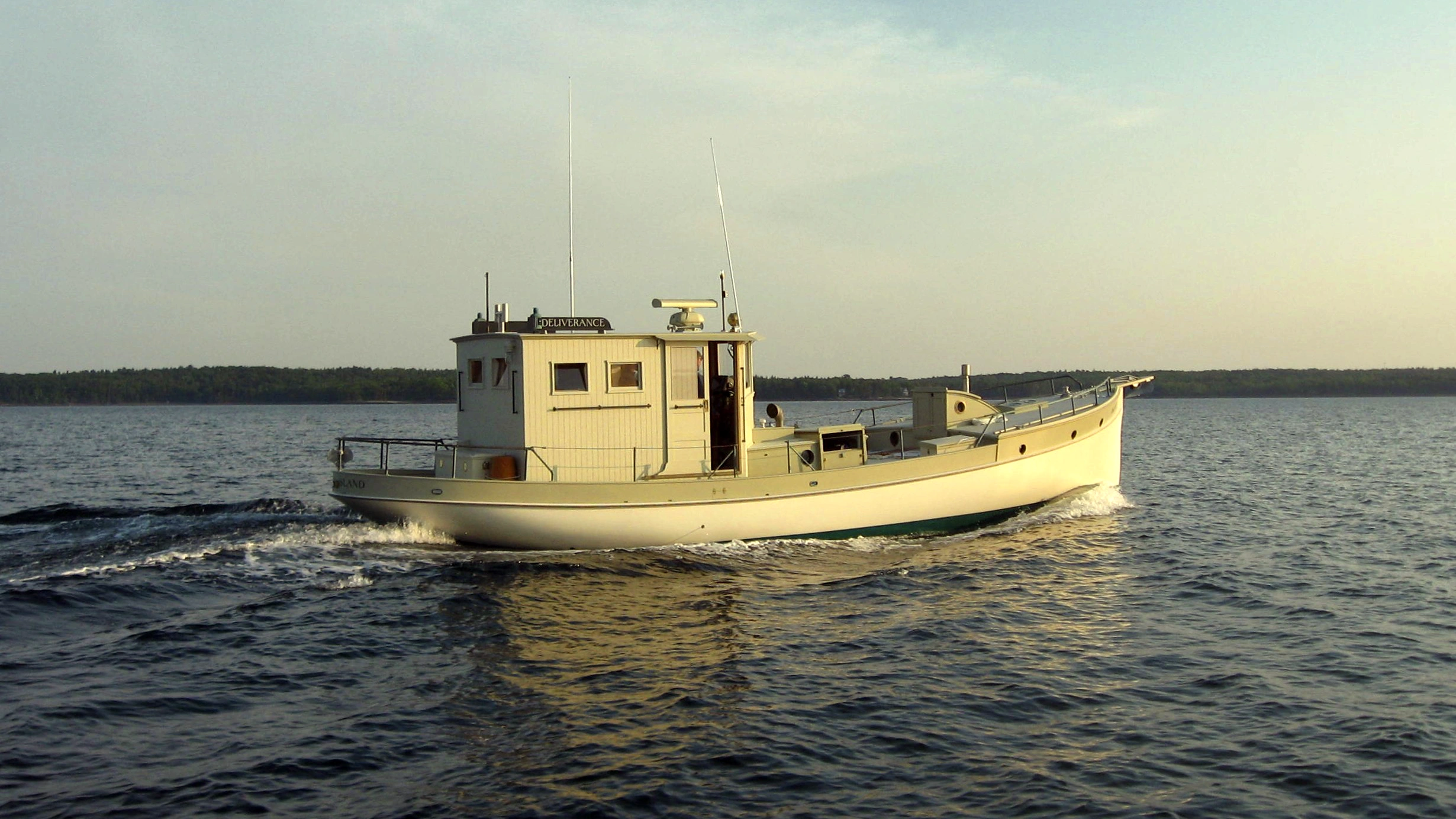 Boat steaming at sunset